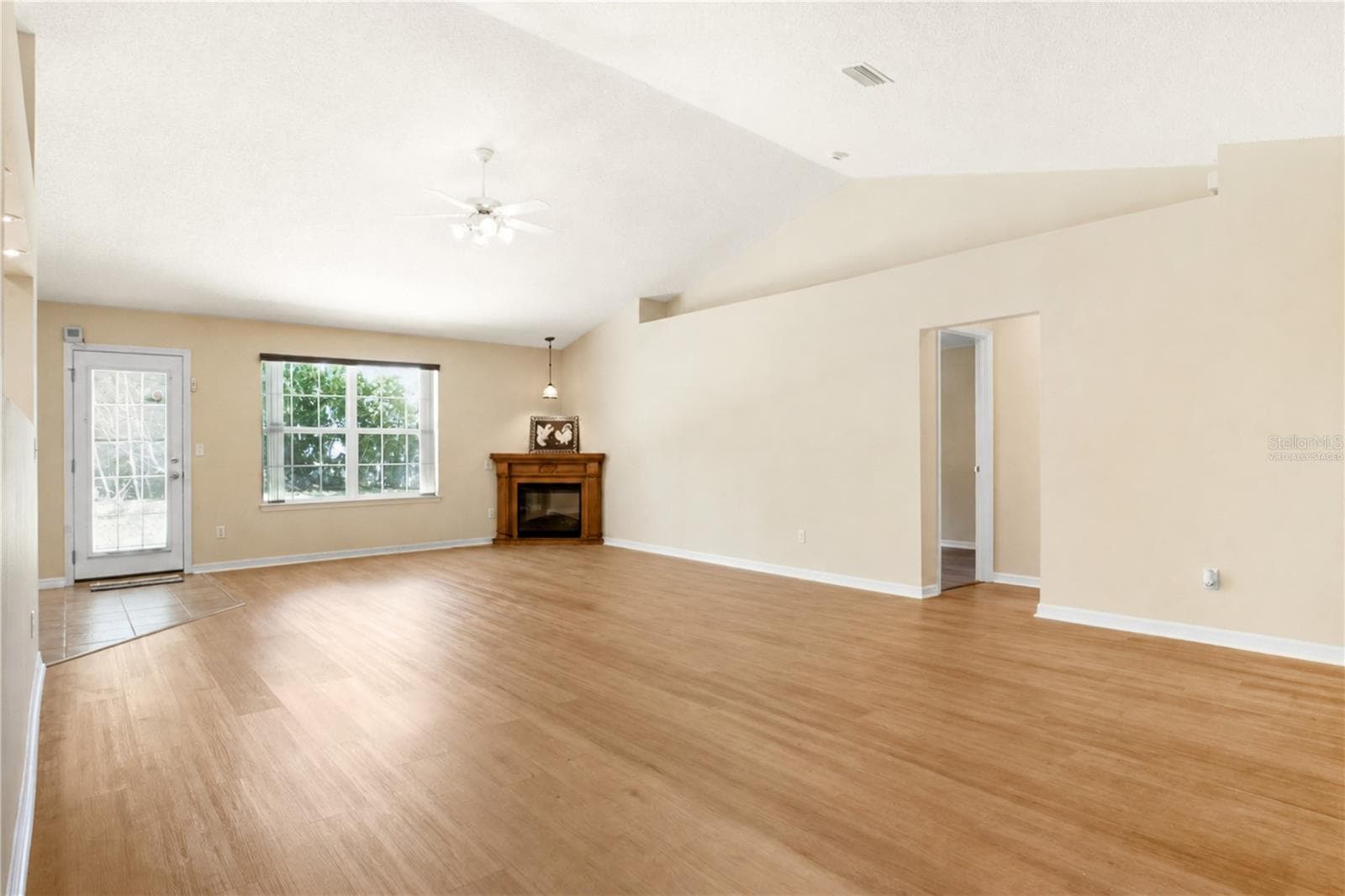 Virtually staged: Great Room without pool table and light from the Front Entrance - 38 PRINCESS ROSE DR, PALM COAST