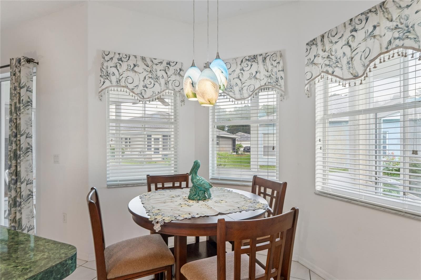 BREAKFAST AREA IS A CHARMER WITH SO MUCH CHEERFUL NATURAL LIGHT - SUMMERTREE PRCL 03A PH 02, NEW PORT RICHEY