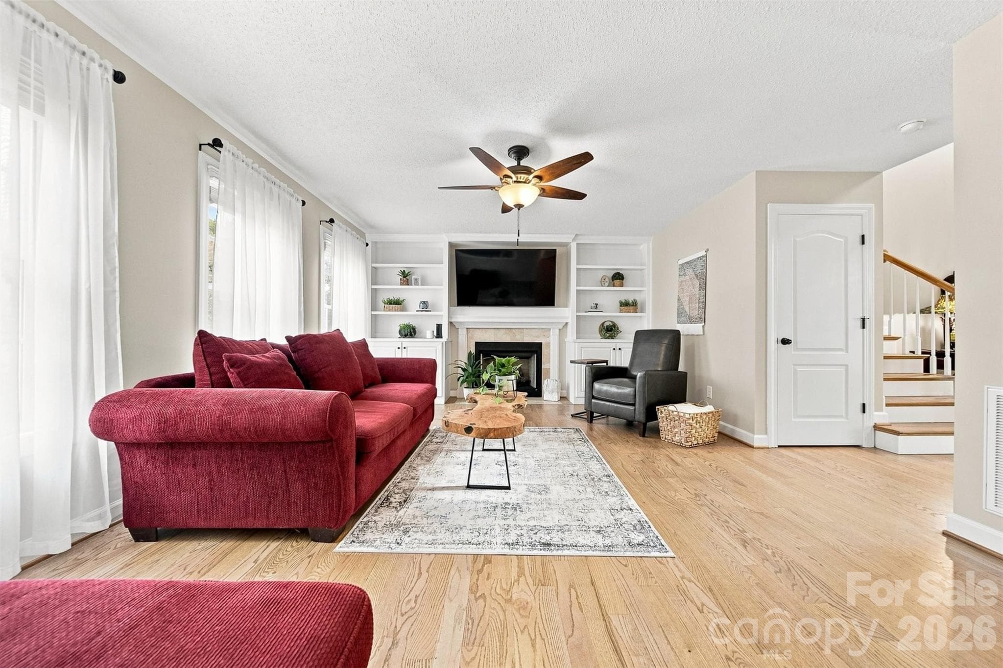 Living Room on main Level with Gas Logs ad Built-in's - 6011 Dockside Drive, Hickory