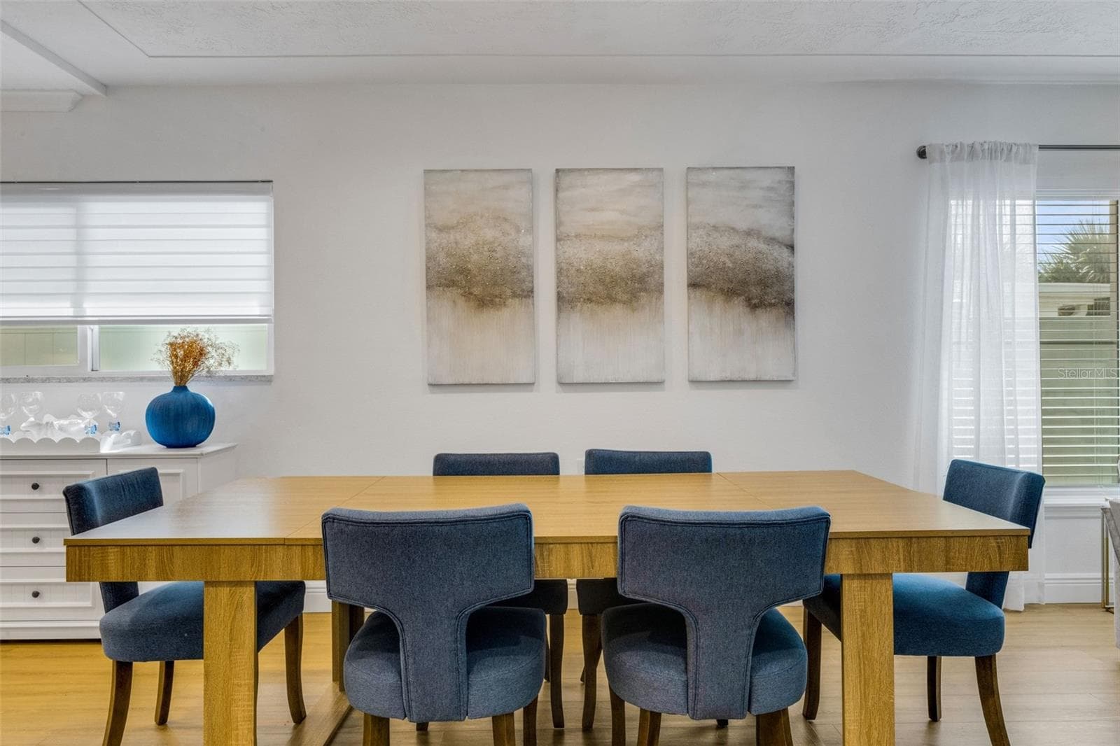 Dining and living areas come together in one bright, welcoming space. - 18317 SUNSET BLVD, REDINGTON SHORES
