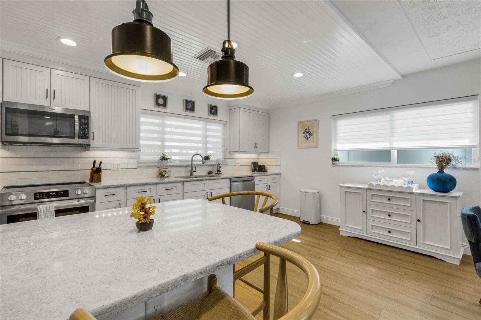 Bright kitchen with abundant cabinetry, counter space and modern stainless-steel appliances. - 18317 SUNSET BLVD, REDINGTON SHORES