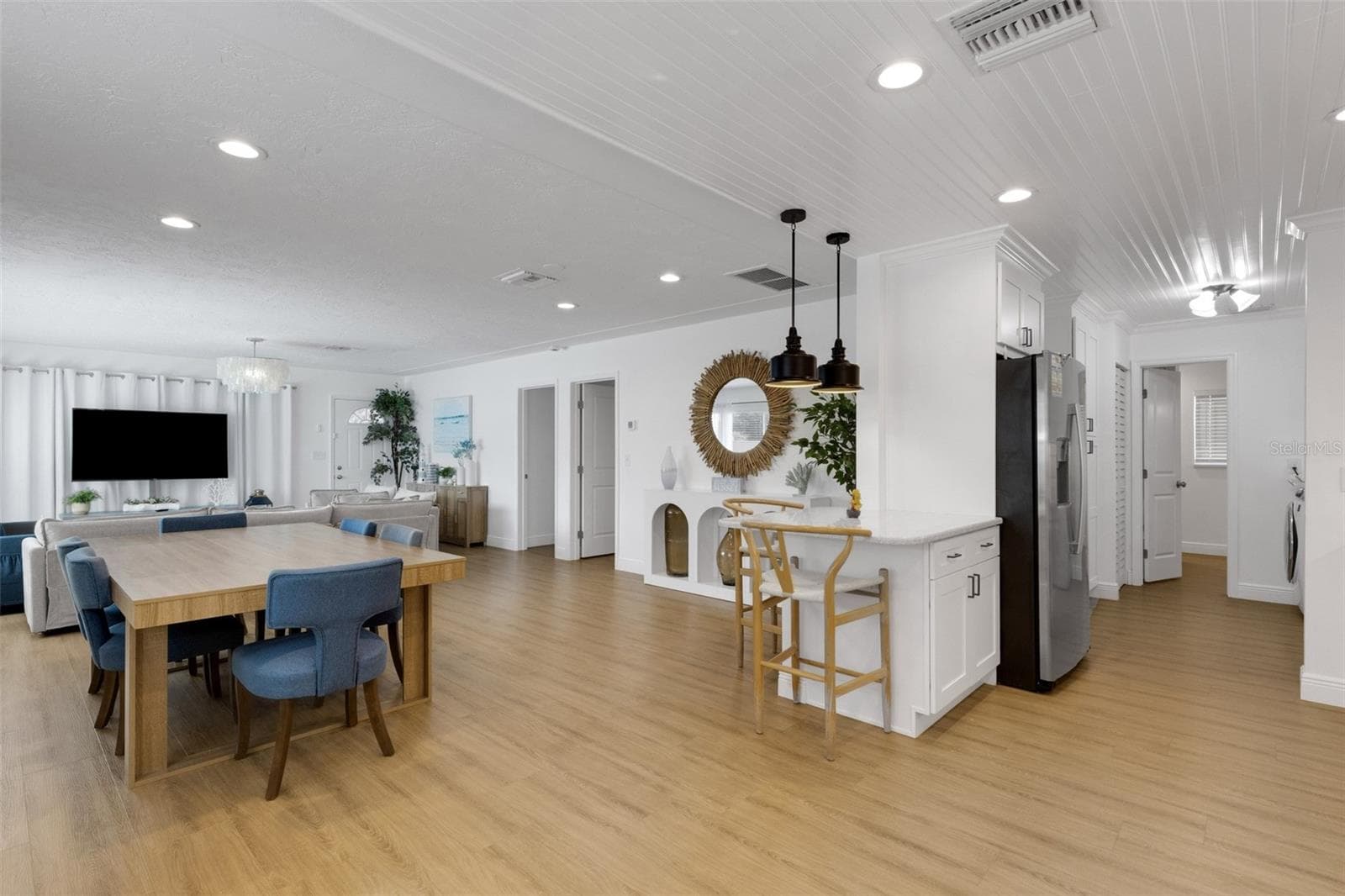 Wide view highlights the open flow between kitchen, dining and living areas. - 18317 SUNSET BLVD, REDINGTON SHORES