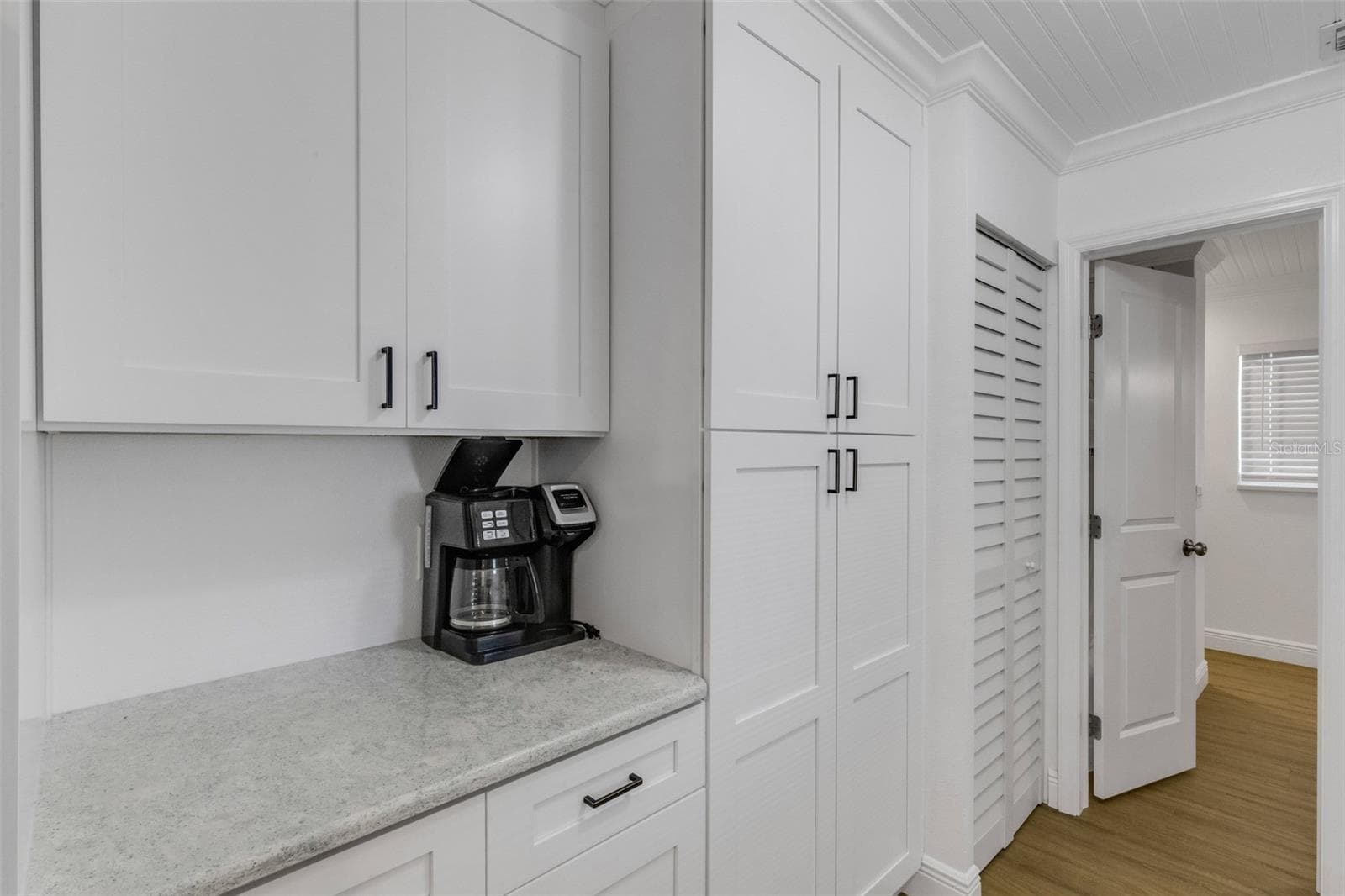 Convenient built-in coffee station and additional kitchen storage. - 18317 SUNSET BLVD, REDINGTON SHORES