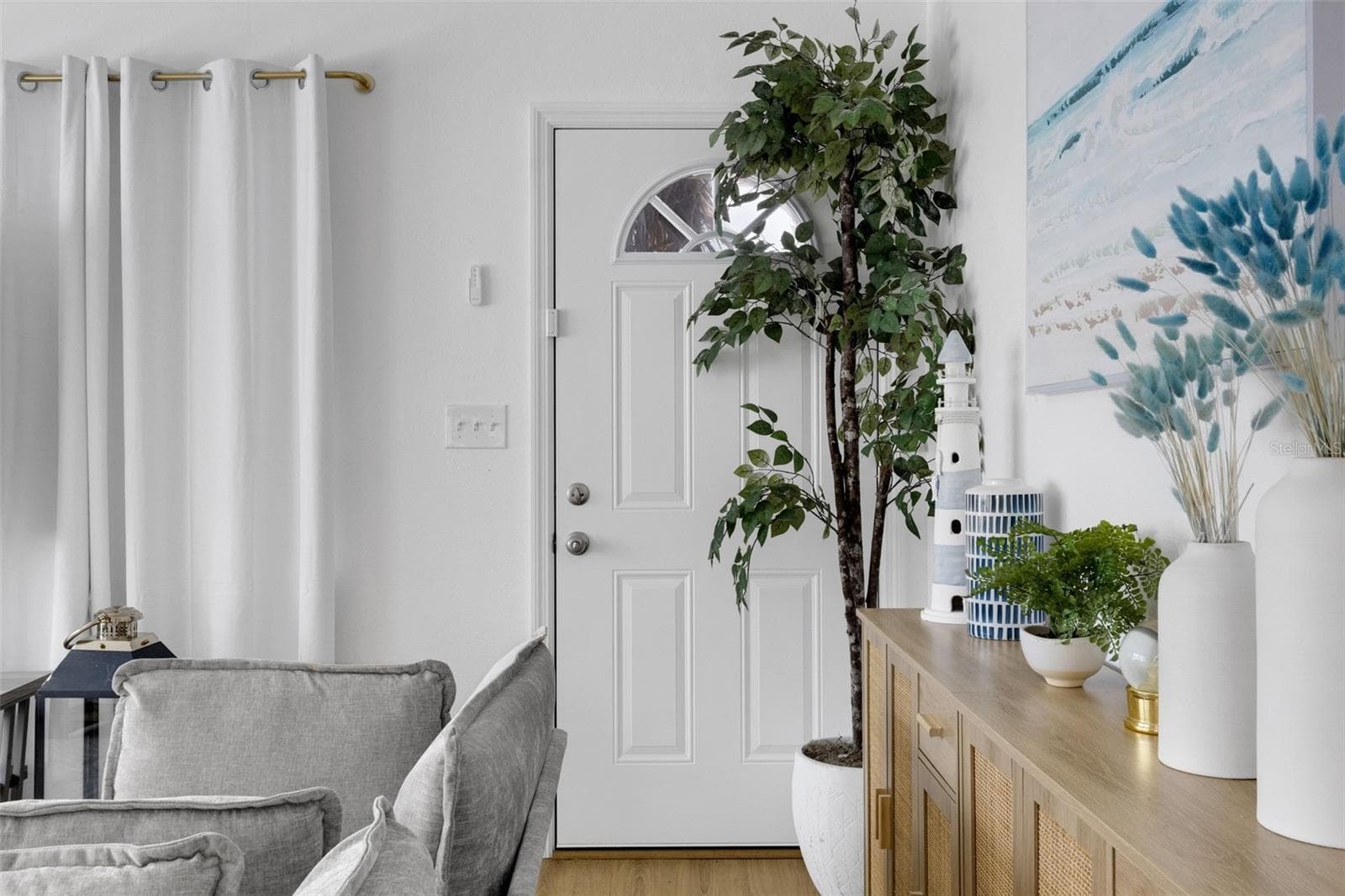 welcoming entry complements the home's fresh , coastal-inspired interior. - 18317 SUNSET BLVD, REDINGTON SHORES