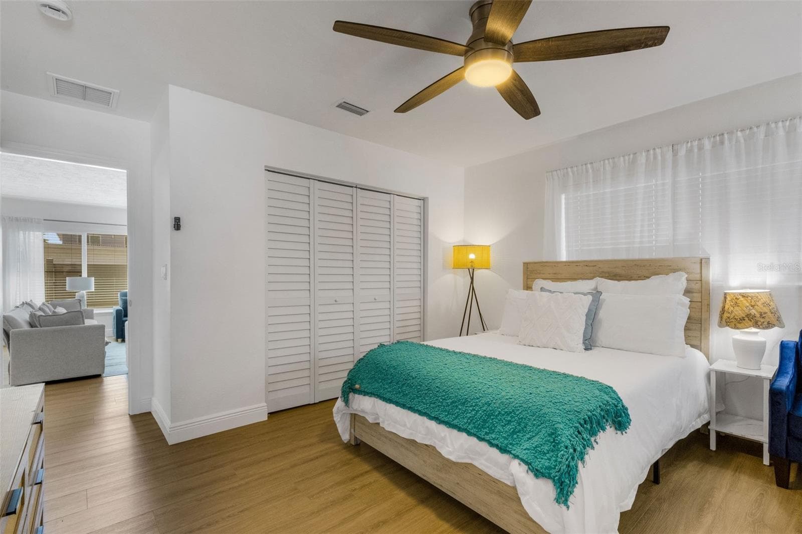 Another view of the spacious primary suite and its relaxed coastal decor. - 18317 SUNSET BLVD, REDINGTON SHORES