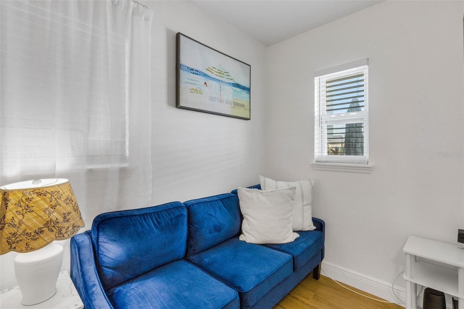 Cozy sitting area creates an additional place to unwind within the primary suite. - 18317 SUNSET BLVD, REDINGTON SHORES