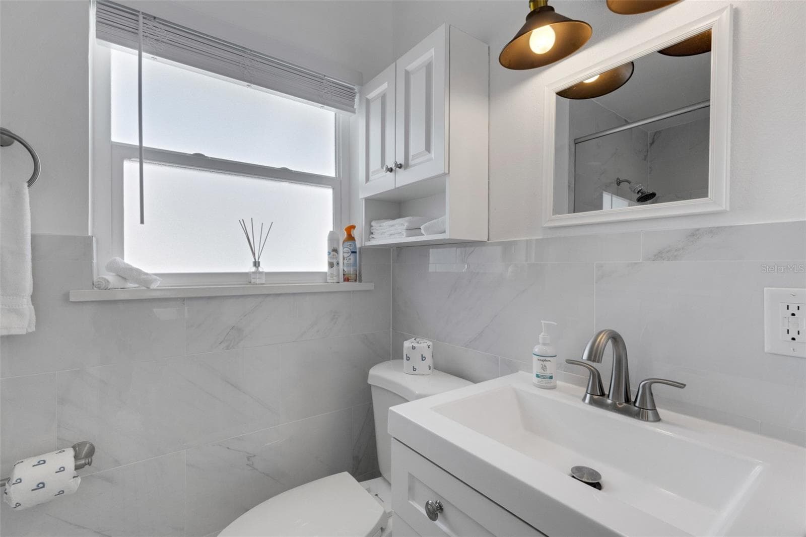 Bright renovated bath continues the home's clean, coastal -inspired design. - 18317 SUNSET BLVD, REDINGTON SHORES