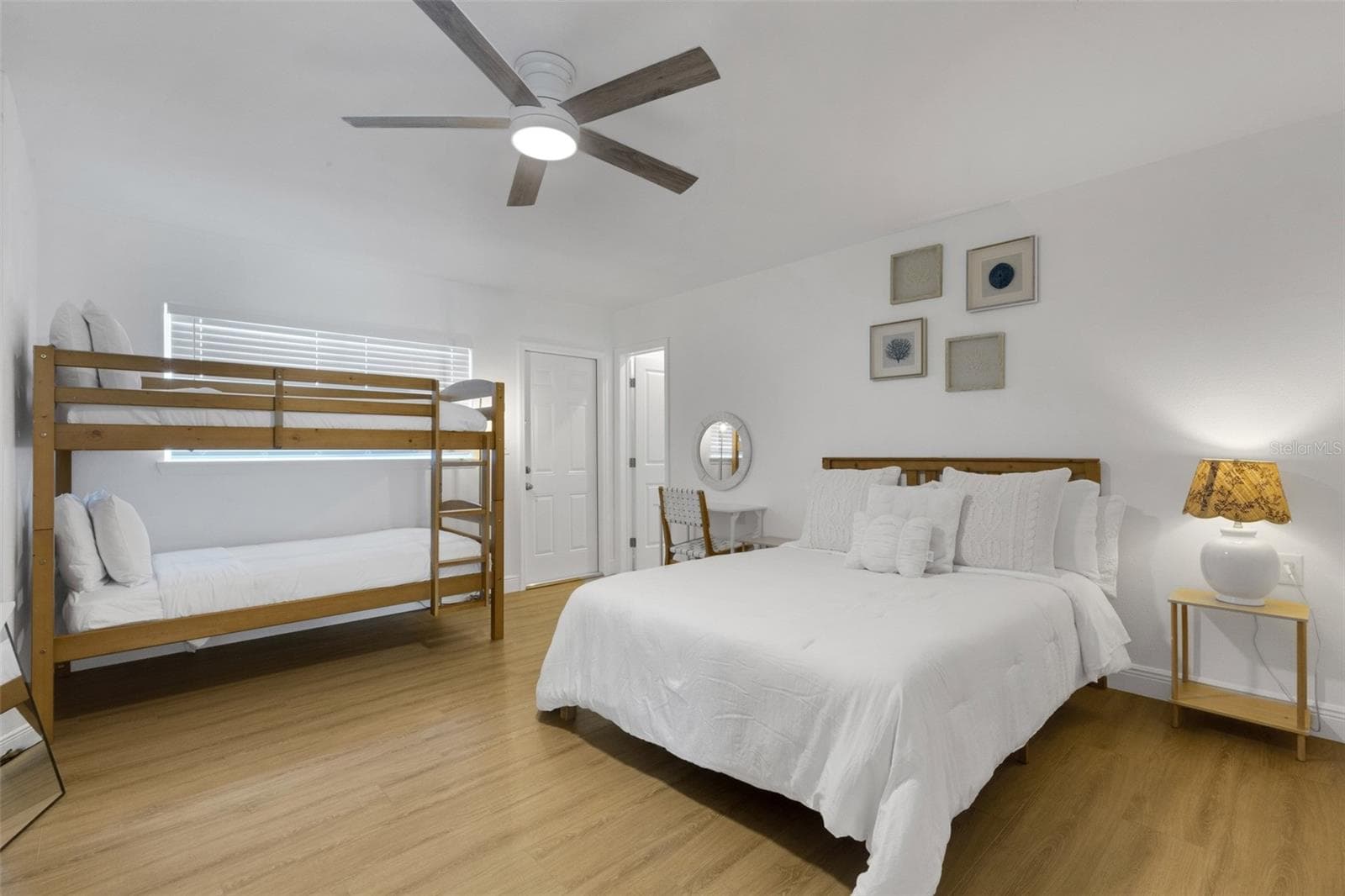 Versatile guest bedroom comfortably accommodates a queen bed plus bunk beds. - 18317 SUNSET BLVD, REDINGTON SHORES