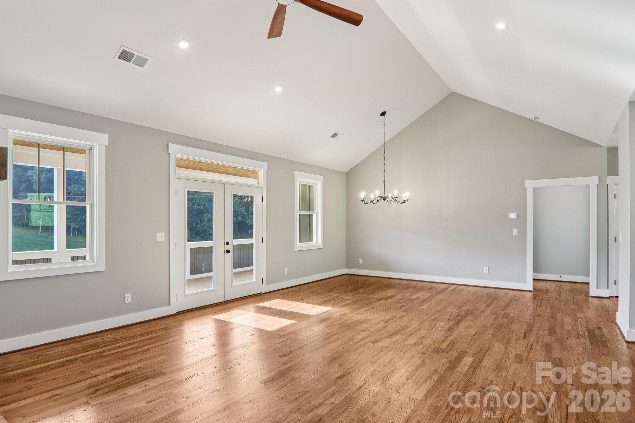 Dining Room/Living room leads out onto the covered deck. - 1060 California Creek Road, Mars Hill