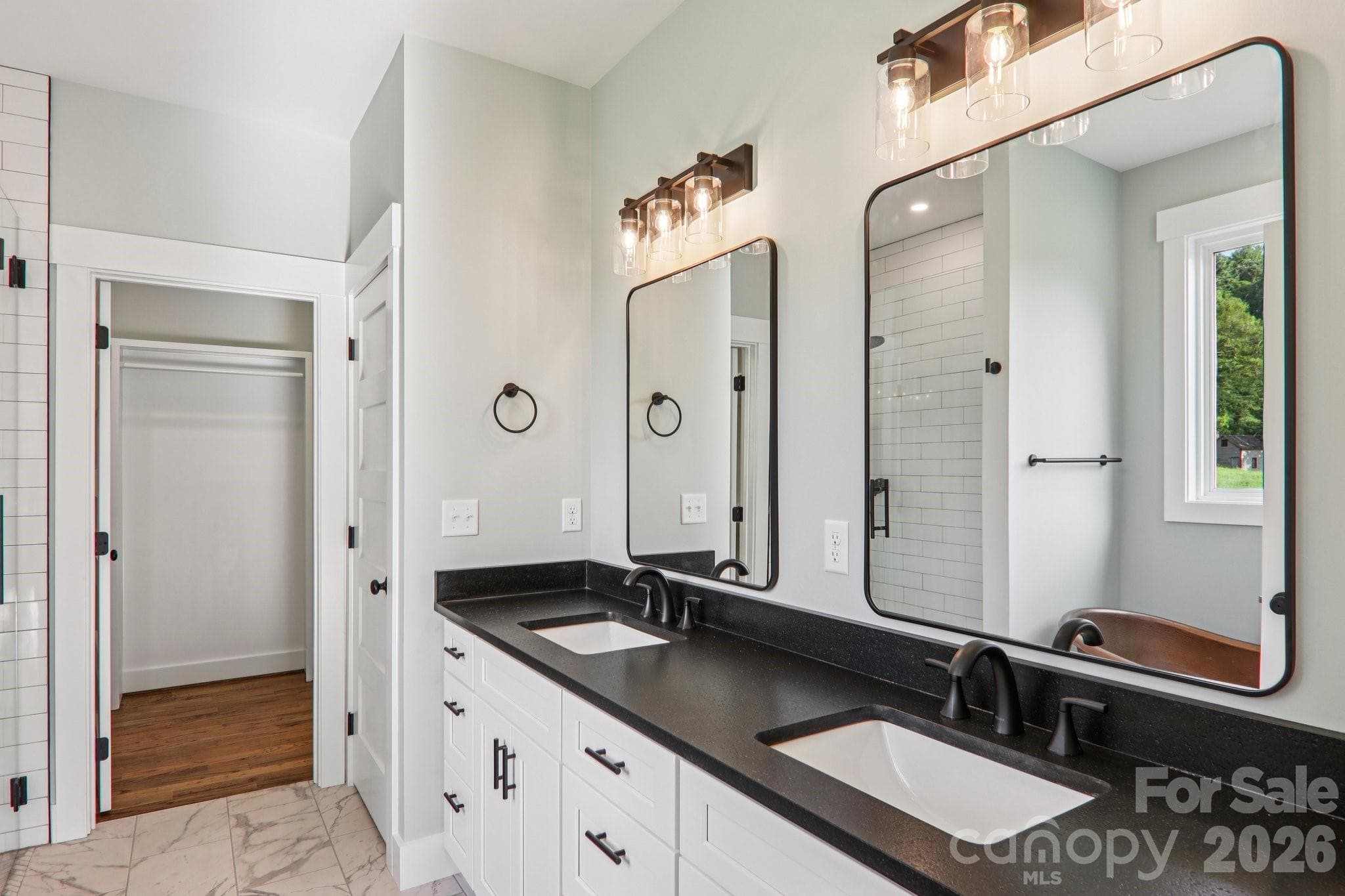Primary bathroom with double vanity. - 1060 California Creek Road, Mars Hill