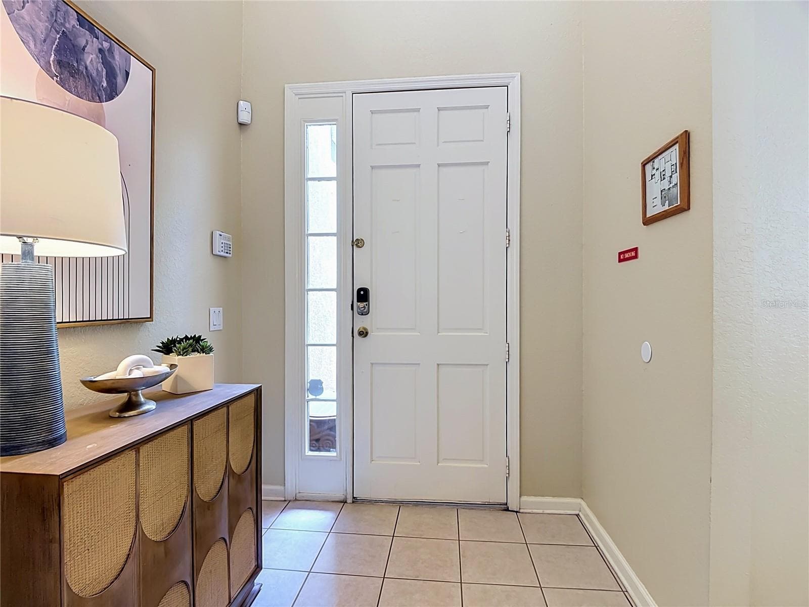 Welcoming foyer with convenient access to the main living areas. - 7742 COMROW ST, KISSIMMEE