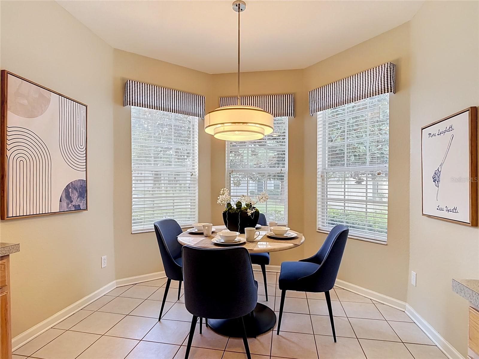 Bright breakfast nook with bay windows and plenty of natural light. - 7742 COMROW ST, KISSIMMEE