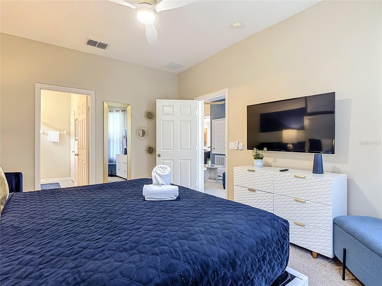Spacious primary suite with direct access to the ensuite bath. - 7742 COMROW ST, KISSIMMEE