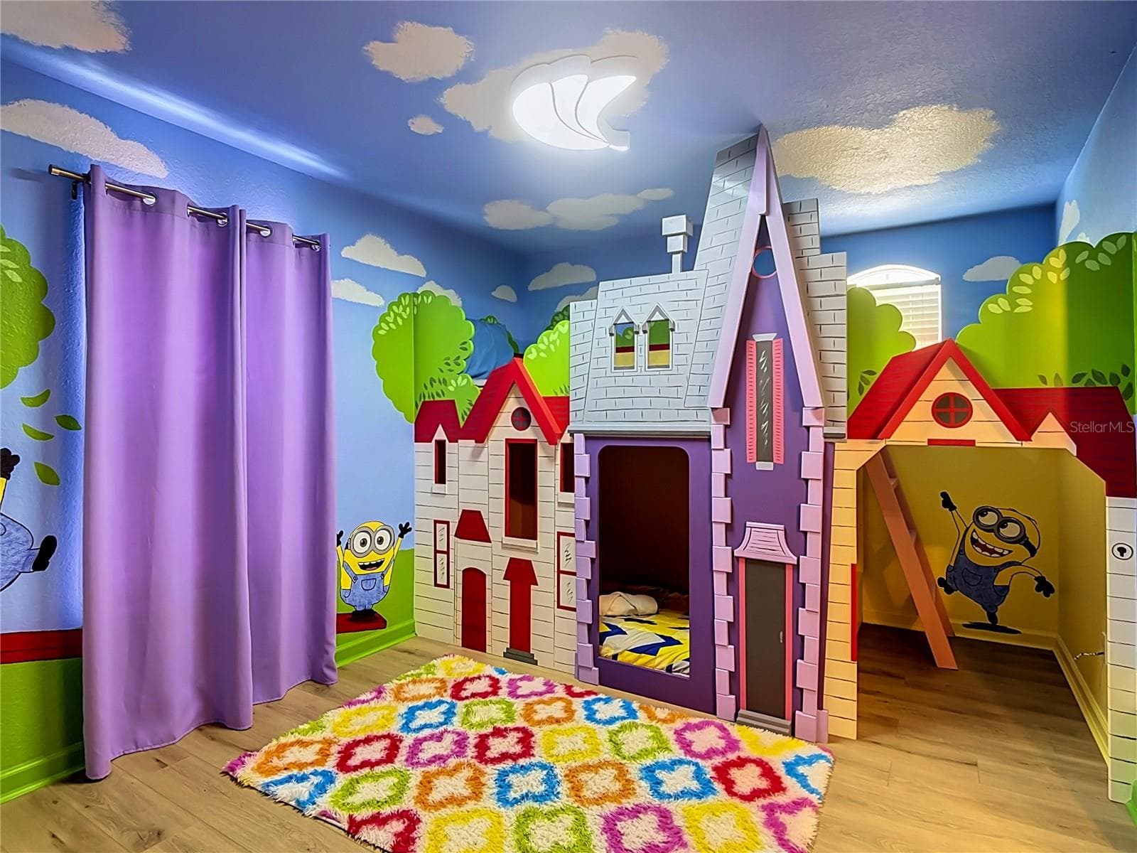 Custom Minions-themed bedroom with colorful décor and bunk beds. - 7742 COMROW ST, KISSIMMEE