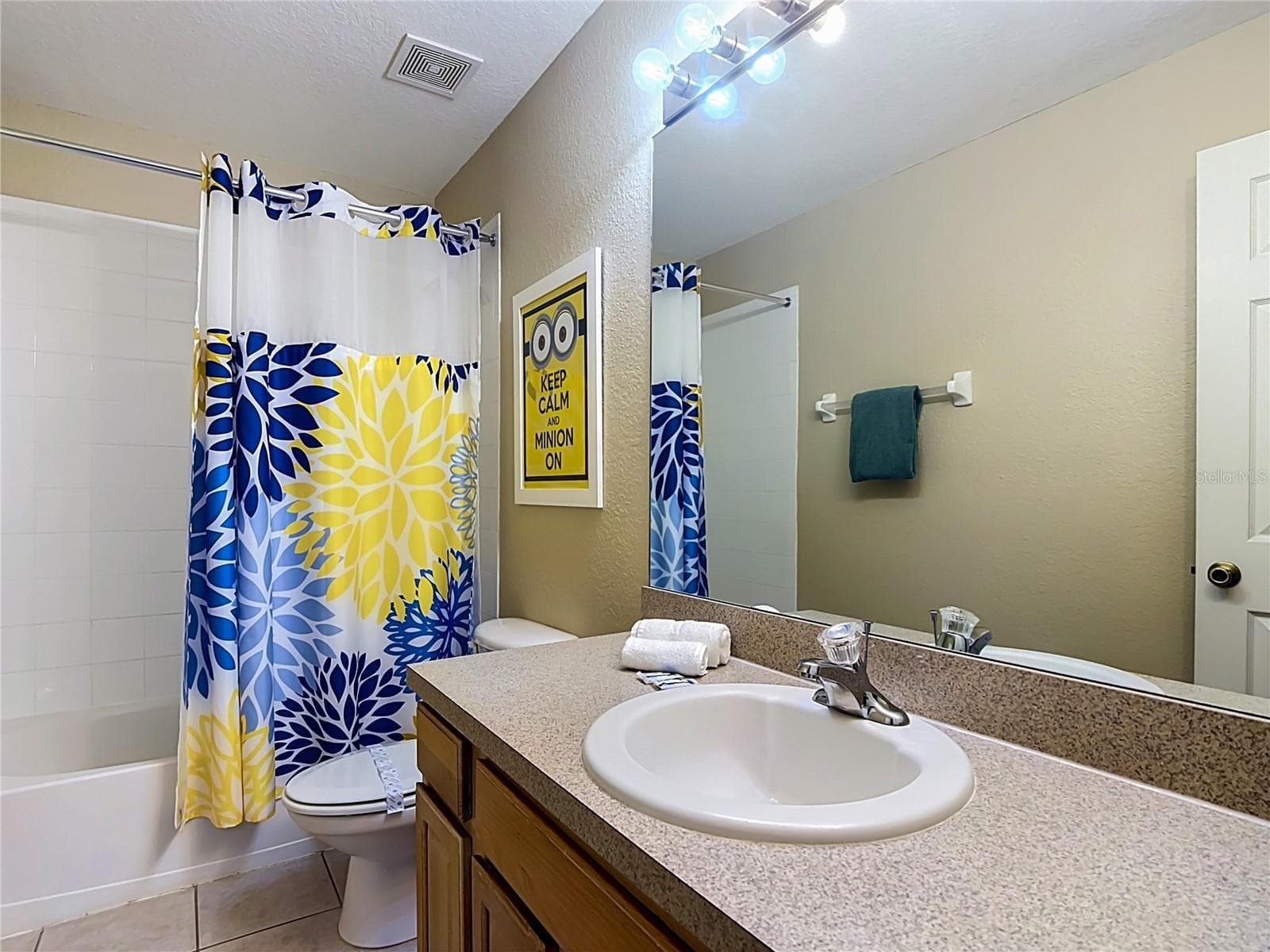 Private ensuite bathroom for the Minions-themed bedroom. - 7742 COMROW ST, KISSIMMEE