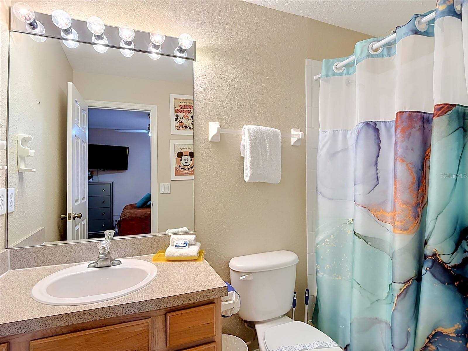 Ensuite bathroom for the upstairs guest bedroom. - 7742 COMROW ST, KISSIMMEE