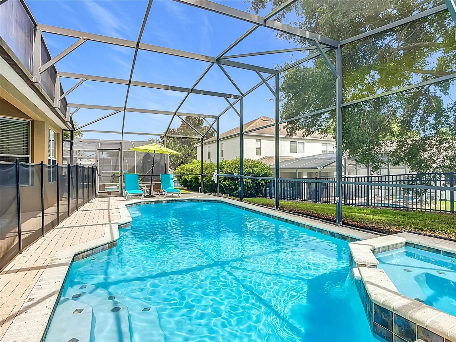 Private screened pool and spa with plenty of space to relax and unwind. - 7742 COMROW ST, KISSIMMEE