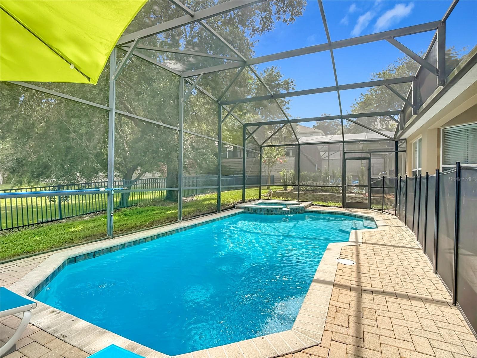 Spacious pool deck designed for enjoying Florida's year-round sunshine. - 7742 COMROW ST, KISSIMMEE