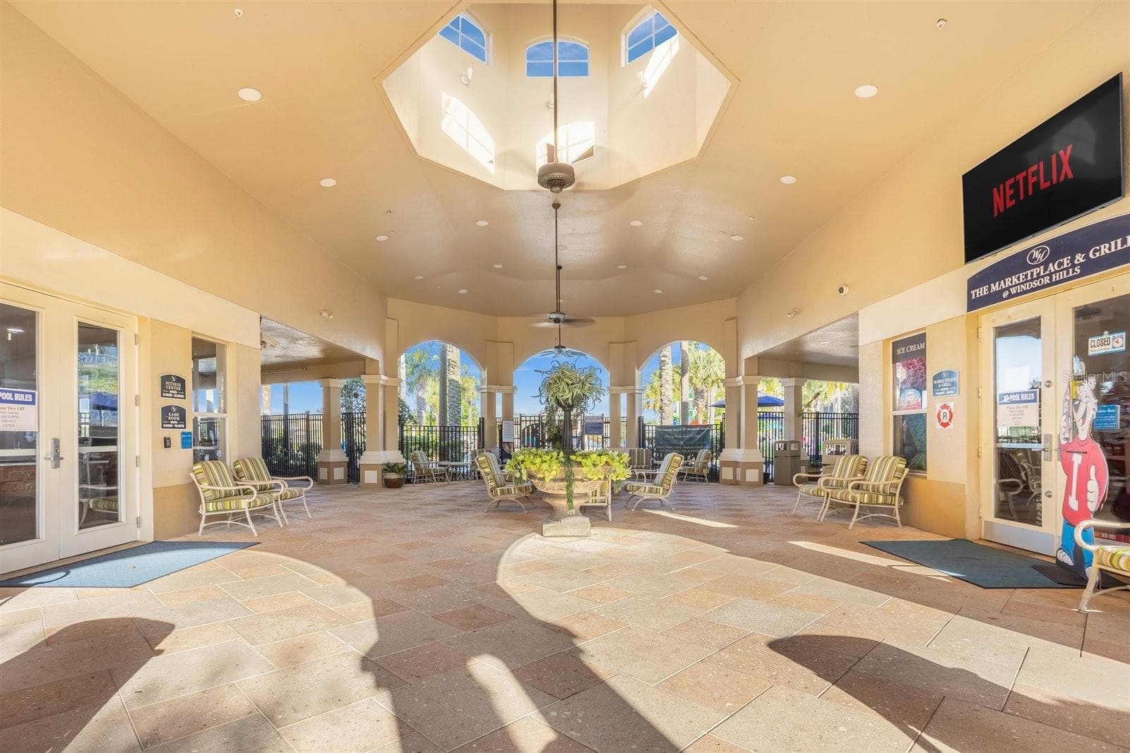 Windsor Hills clubhouse featuring a welcoming lobby and gathering spaces. - 7742 COMROW ST, KISSIMMEE