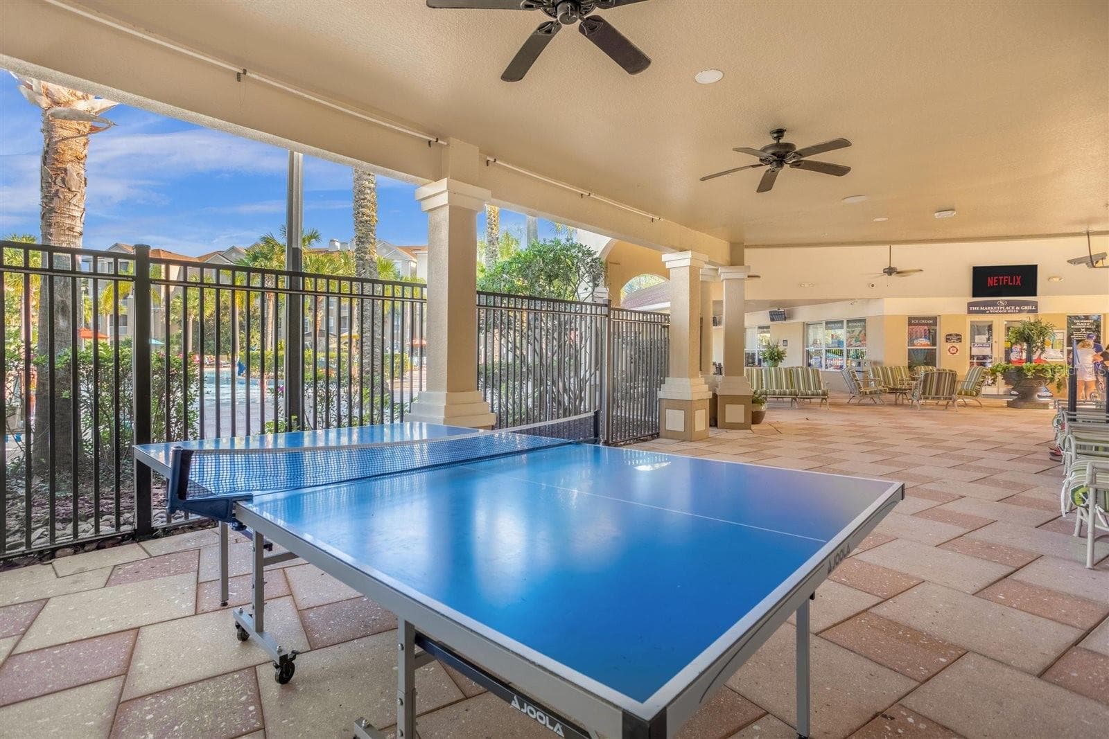 Covered recreation area with ping pong and outdoor games. - 7742 COMROW ST, KISSIMMEE
