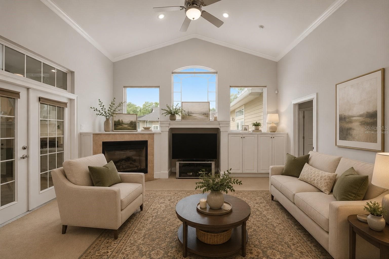 Large family room with access to sunroom, virtually staged - 1446 SW 87TH ST, GAINESVILLE
