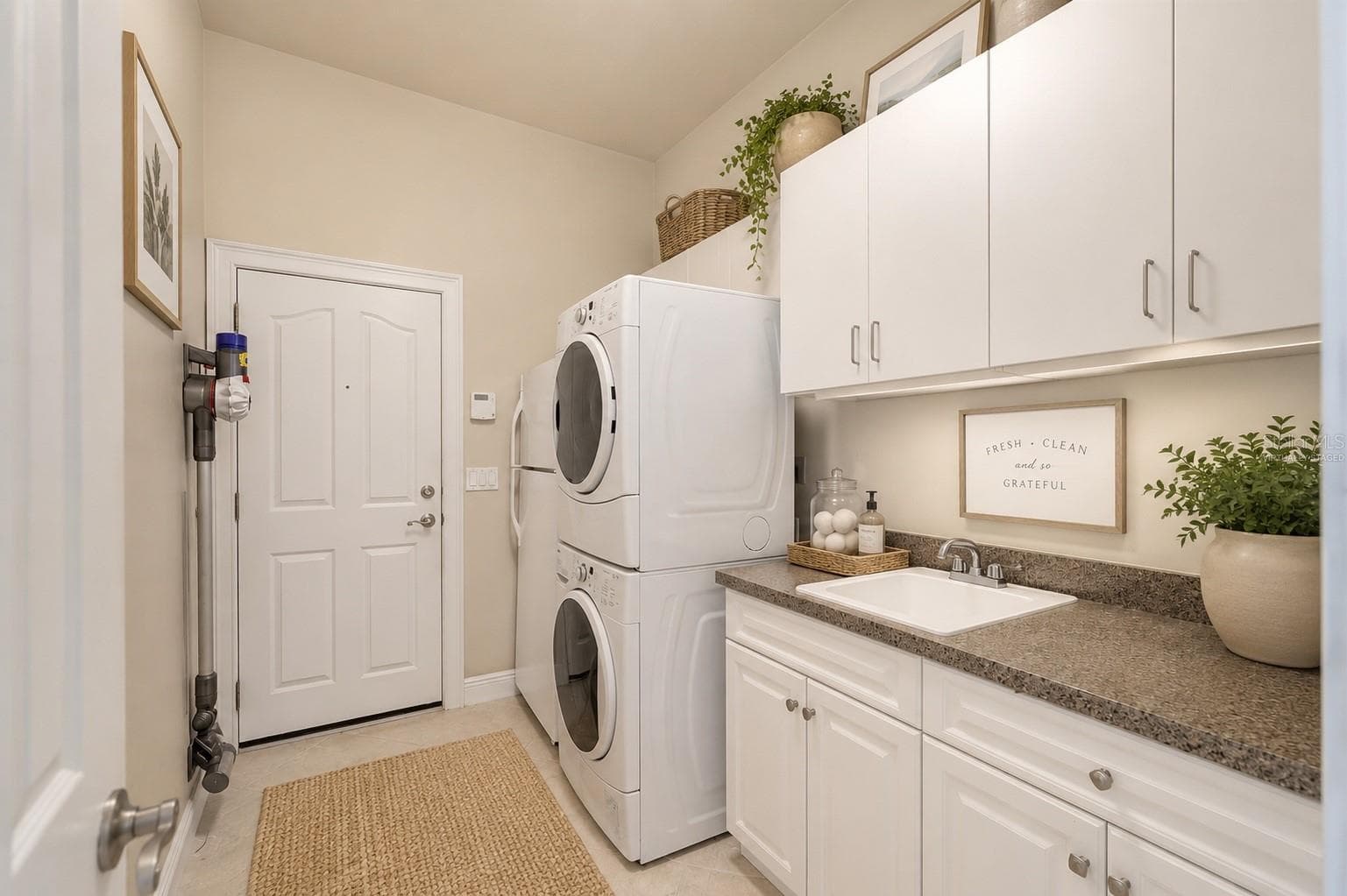Beautiful laundry center, virtually staged - 1446 SW 87TH ST, GAINESVILLE