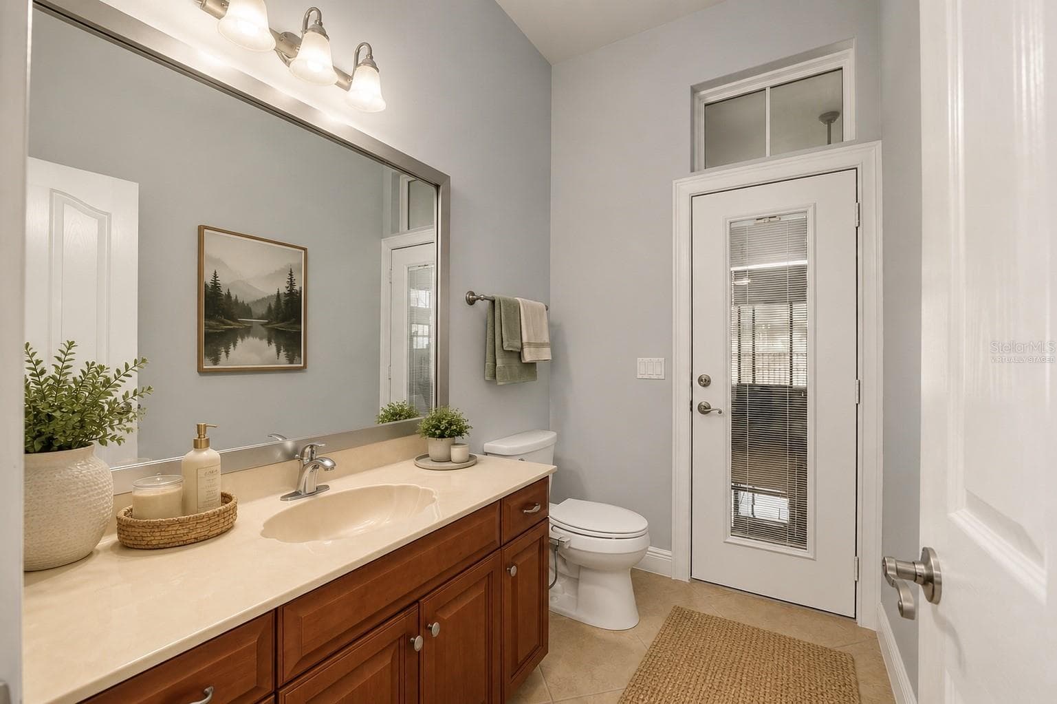 Sunroom has access to virtually staged bathroom - 1446 SW 87TH ST, GAINESVILLE