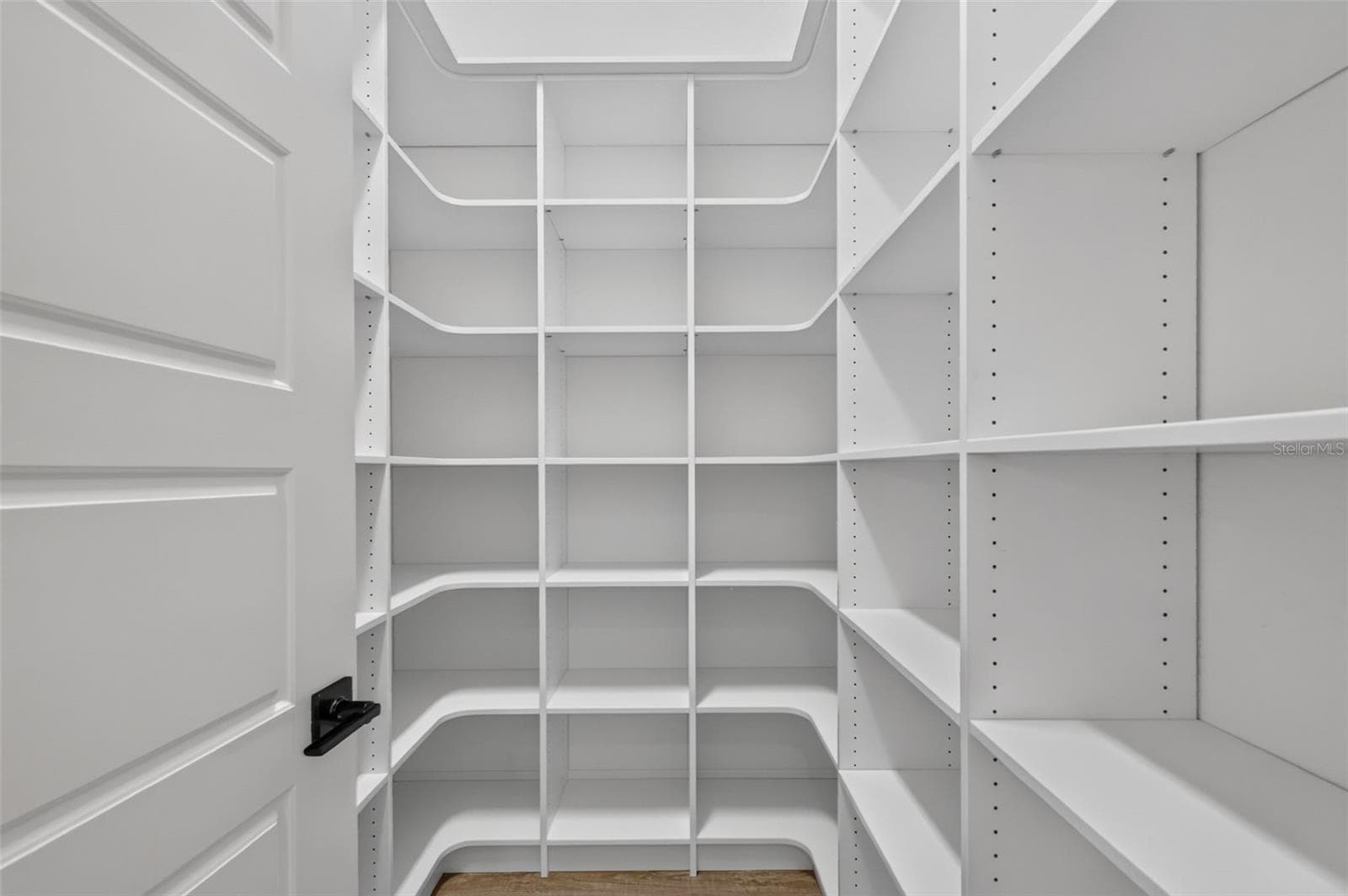 Primary Bedroom Customized Walk-In Closet - 724 SHIVERS LOOP, THE VILLAGES
