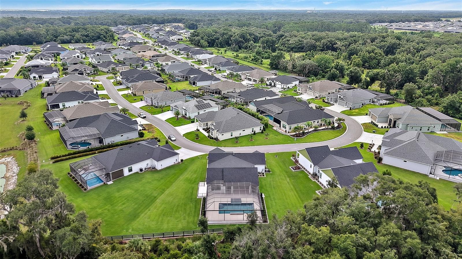 Aerial Rear Elevation with Lake Okahumpka PRESERVE - 724 SHIVERS LOOP, THE VILLAGES