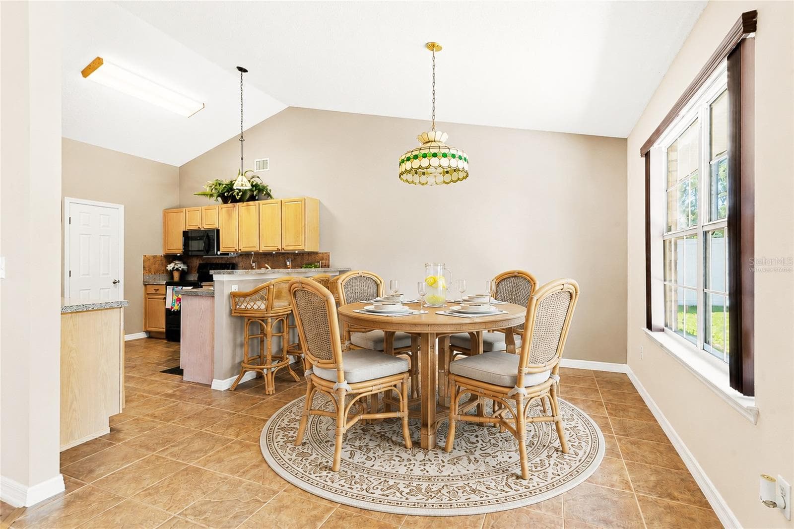 Virtually Staged Breakfast Nook with a Round Table Option - 38 PRINCESS ROSE DR, PALM COAST
