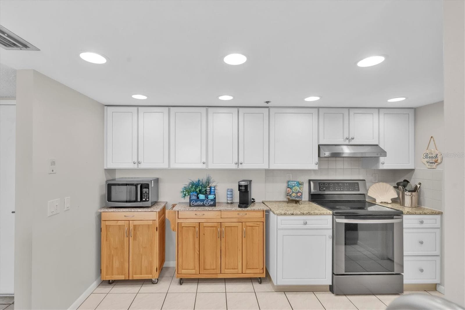 White Cabinetry, Granite Countertops and Stainless-Steel Appliances - 6287 BAHIA DEL MAR CIR #401, ST PETERSBURG