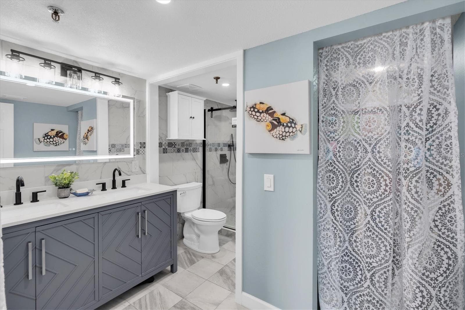Spa-Inspired Primary Bath with Inlaid Tile Shower and Rain Showerhead - 6287 BAHIA DEL MAR CIR #401, ST PETERSBURG
