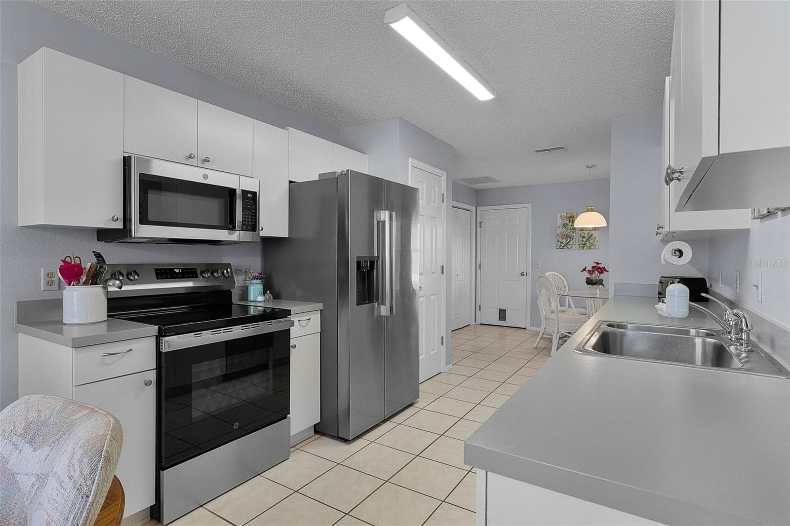 Galley Kitchen With New Appliances - 2018 CASTANO PL, THE VILLAGES