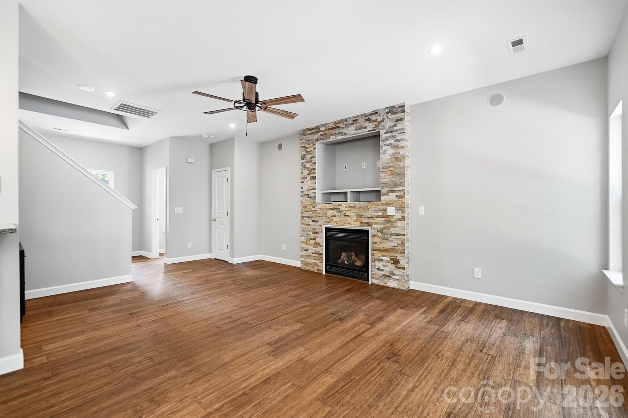 Living Room with gas fireplace and upgraded fan - 11402 Heritage Green Drive, Cornelius