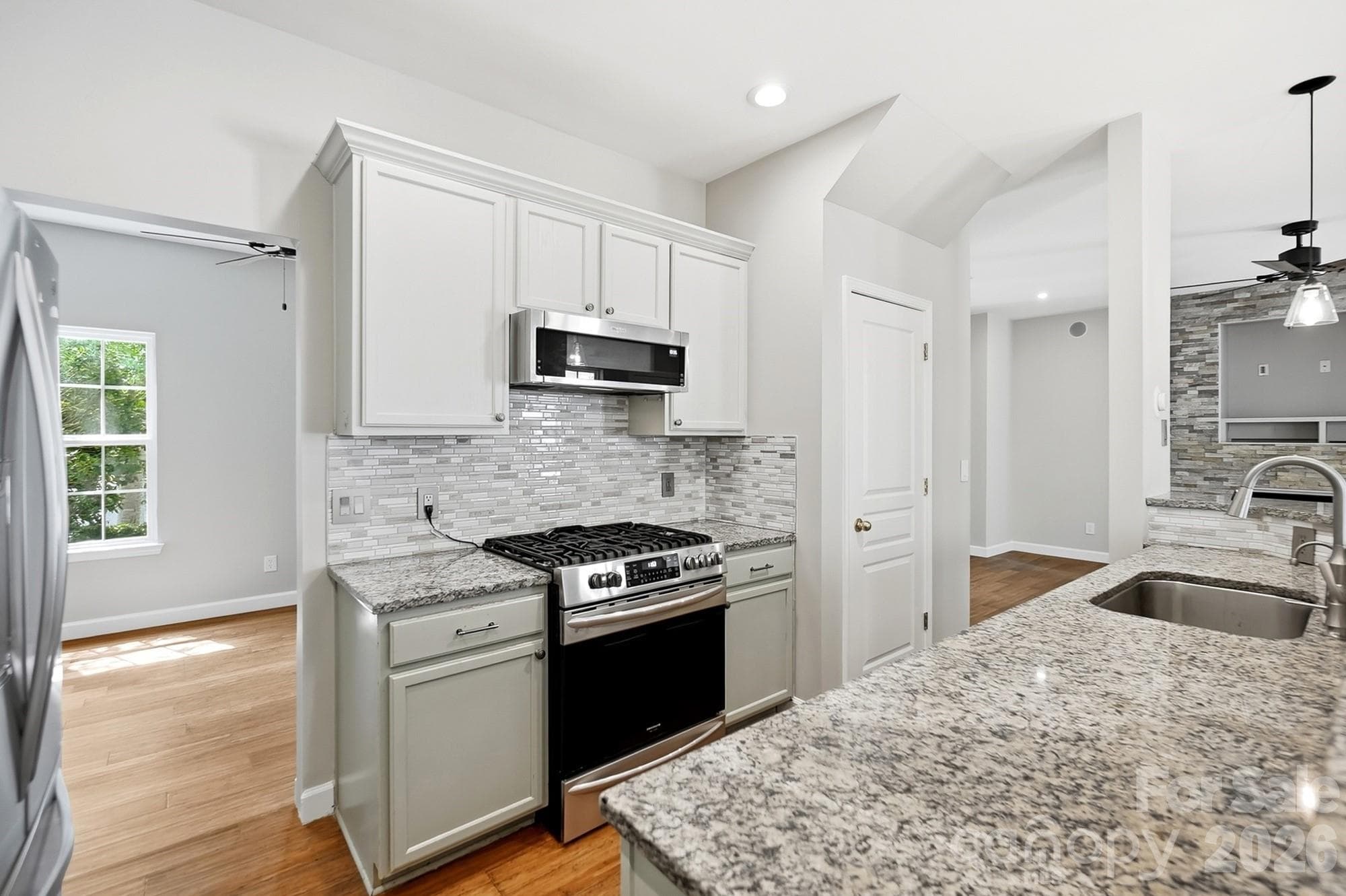 Gas stove with low profile convection microwave - 11402 Heritage Green Drive, Cornelius