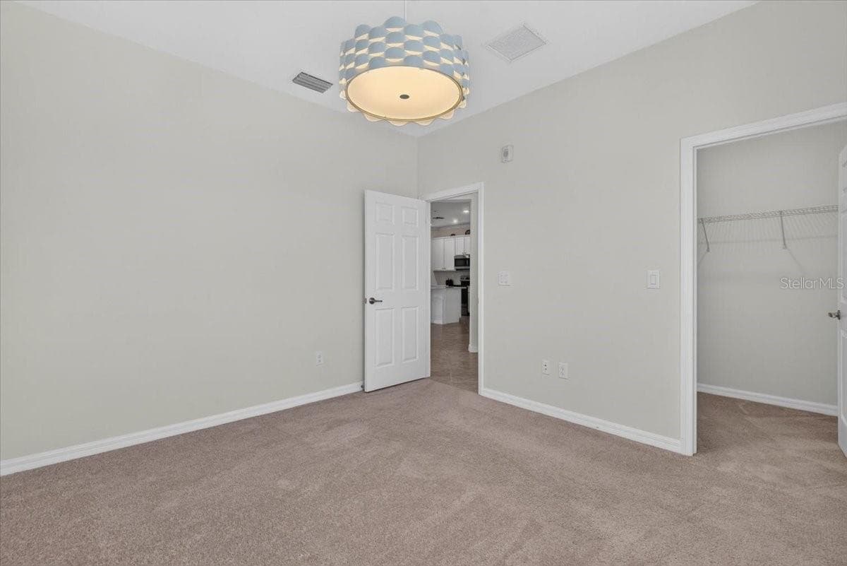 Second Bedroom with a small walk-in closet - 10059 CROOKED CREEK DR #202, VENICE