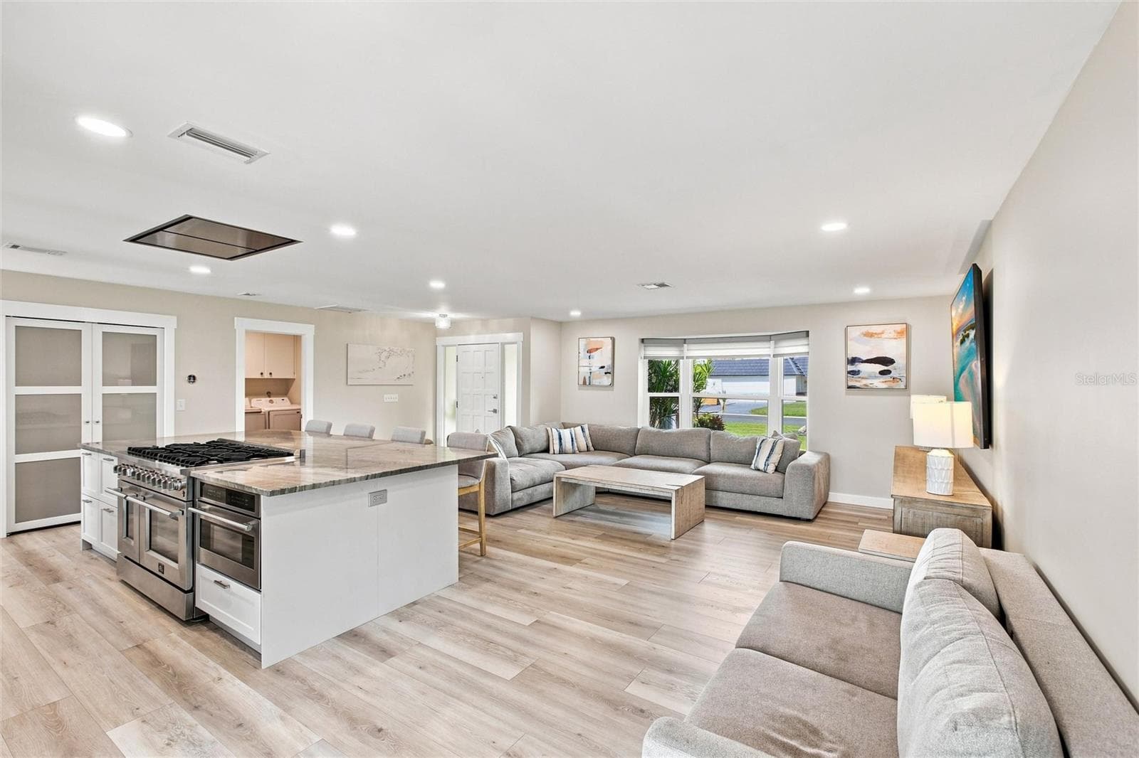 Kitchen and Living Room (oversized island, custom pantry, 8 burner gas range) - 302 DEGAS DR, NOKOMIS