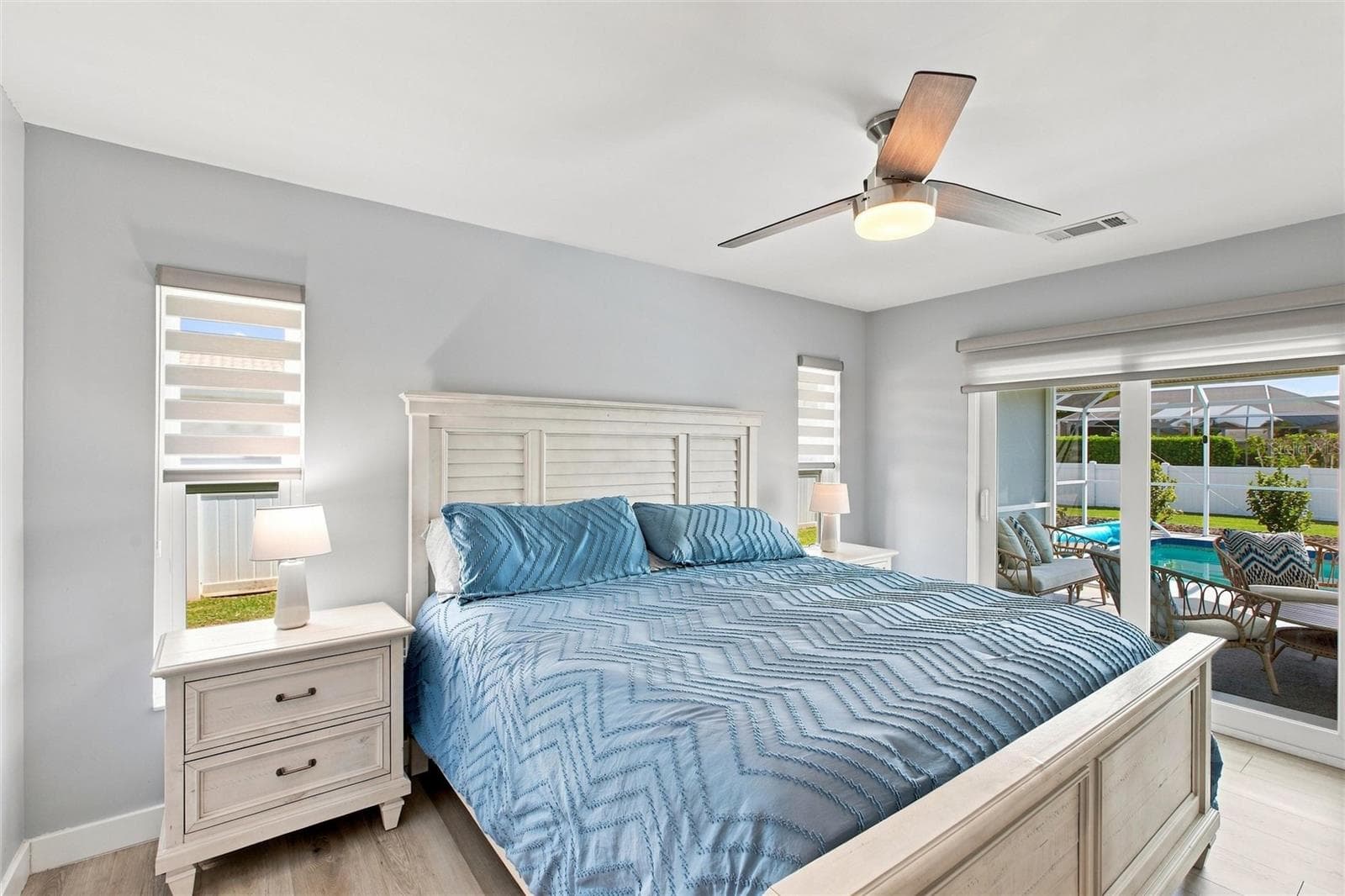 Primary Bedroom, (impact sliders leading to screened lanai and pool) - 302 DEGAS DR, NOKOMIS