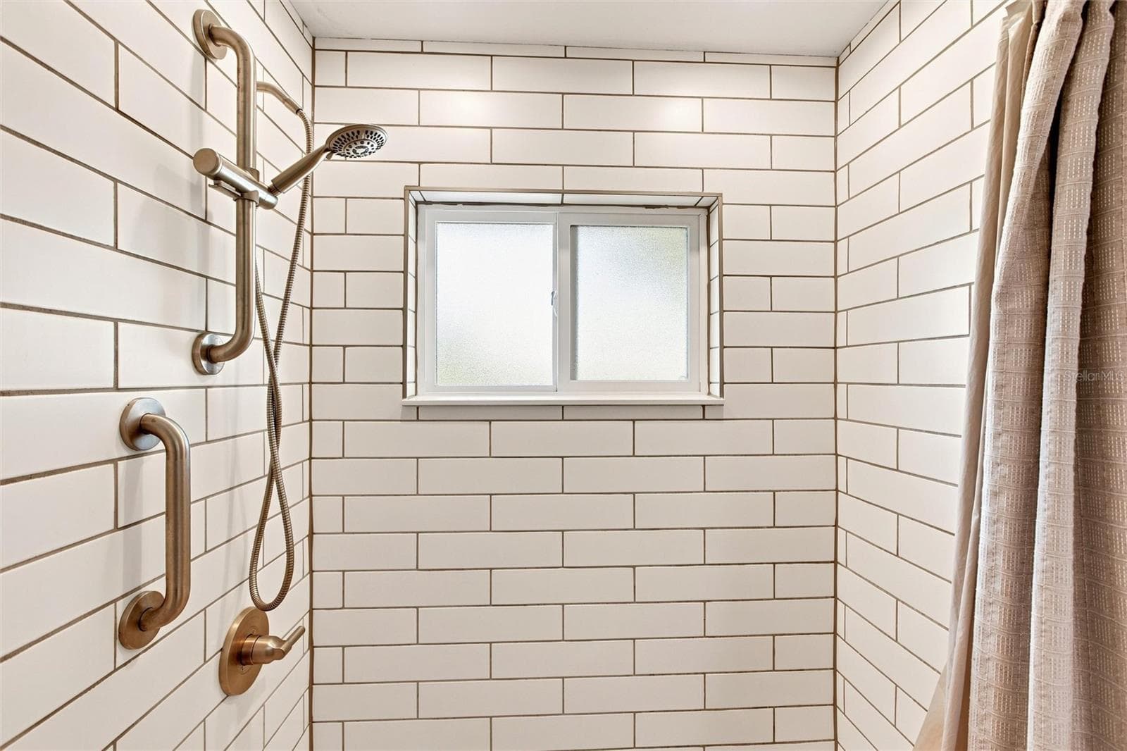 Guest Bathroom with tub and tile shower - 302 DEGAS DR, NOKOMIS