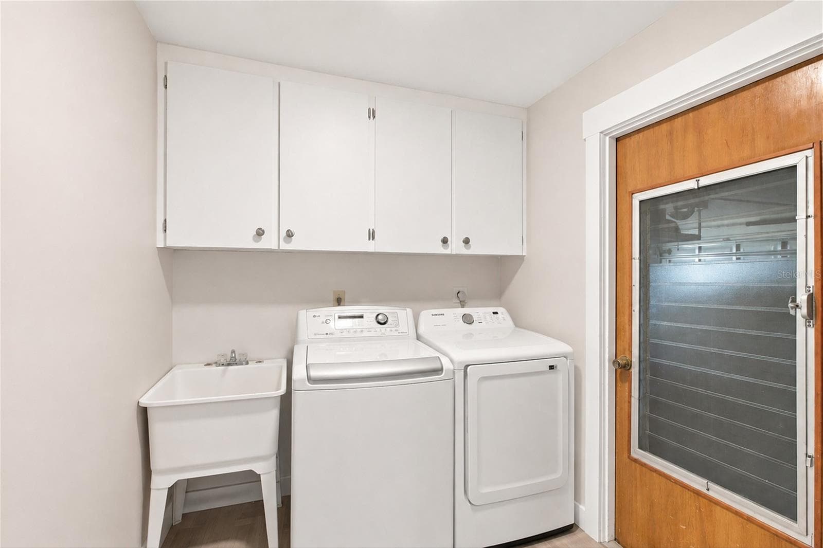 Laundry Room with laundry tub (some wall items removed virtually) - 302 DEGAS DR, NOKOMIS