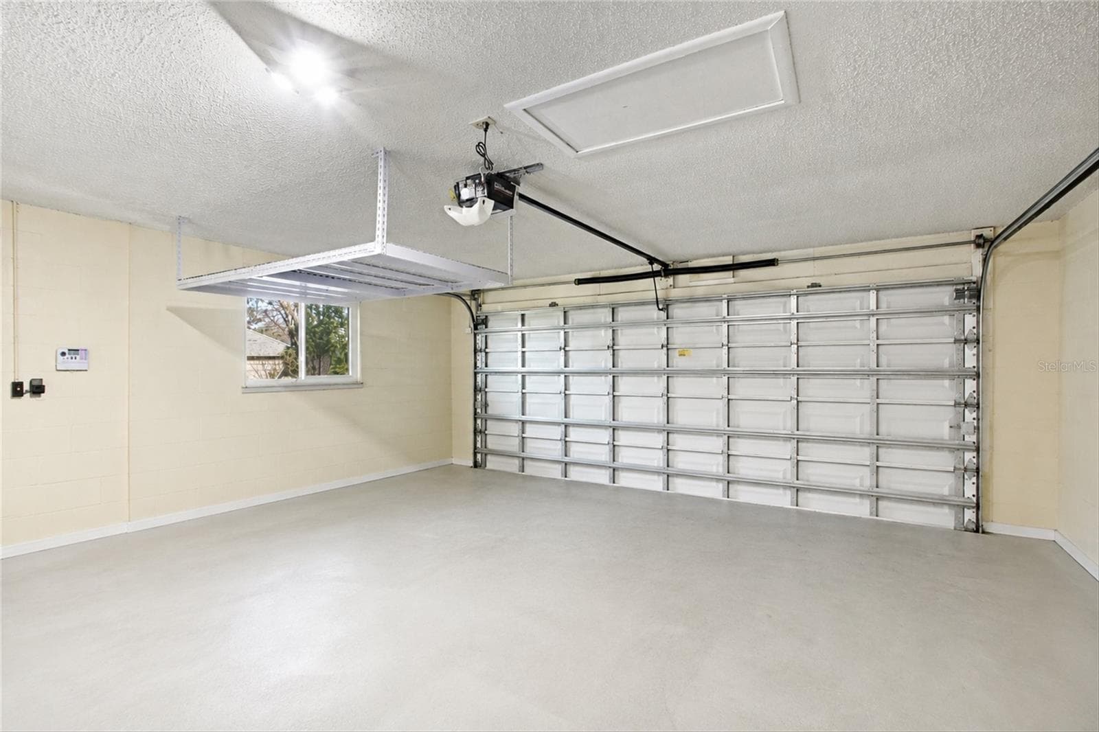 2-car garage (photo enhanced to remove items) - 302 DEGAS DR, NOKOMIS