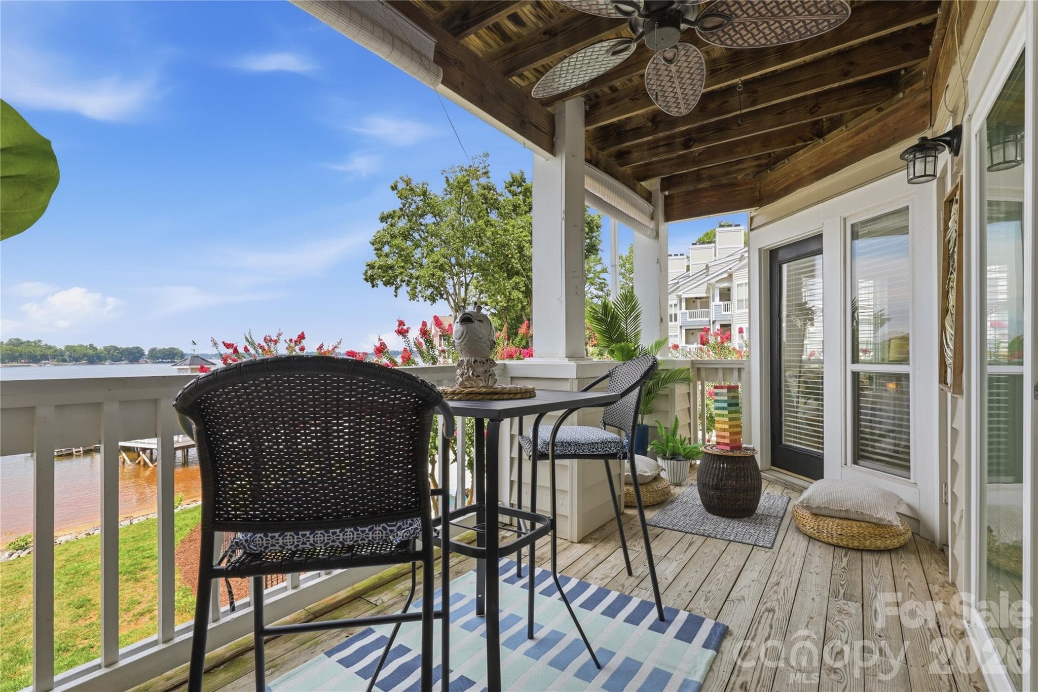 Covered waterfront porch extends the living space outdoors. - 932 Southwest Drive, Davidson