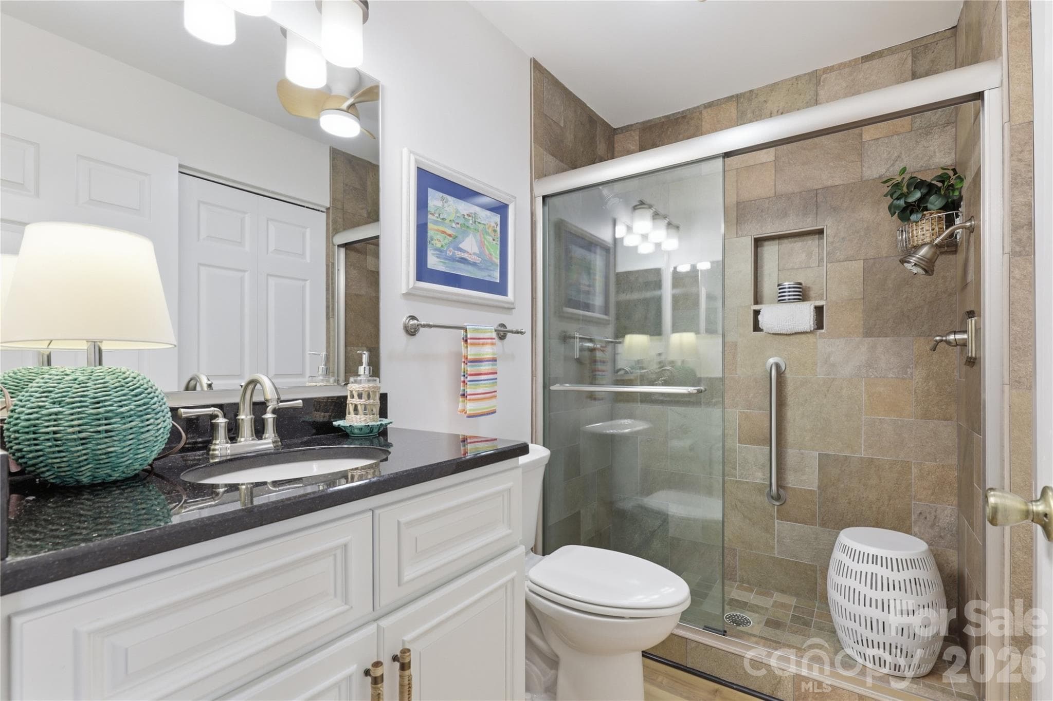Second full bathroom conveniently serves guests and the living area. - 932 Southwest Drive, Davidson