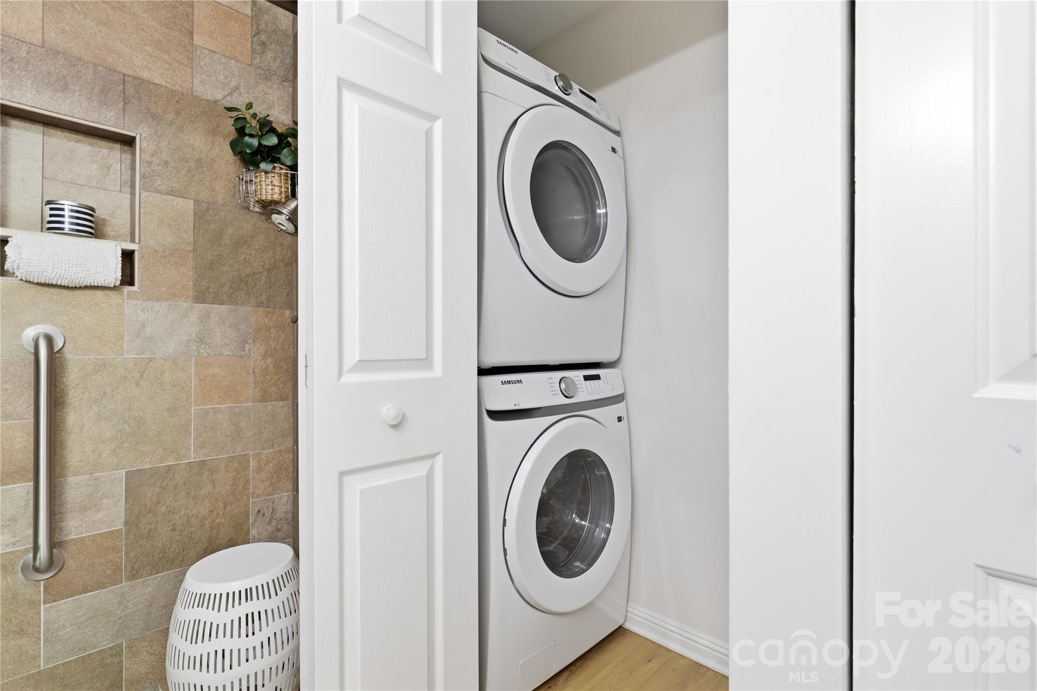 In-unit laundry closet keeps household essentials close at hand - Brand-new appliances throughout - 932 Southwest Drive, Davidson