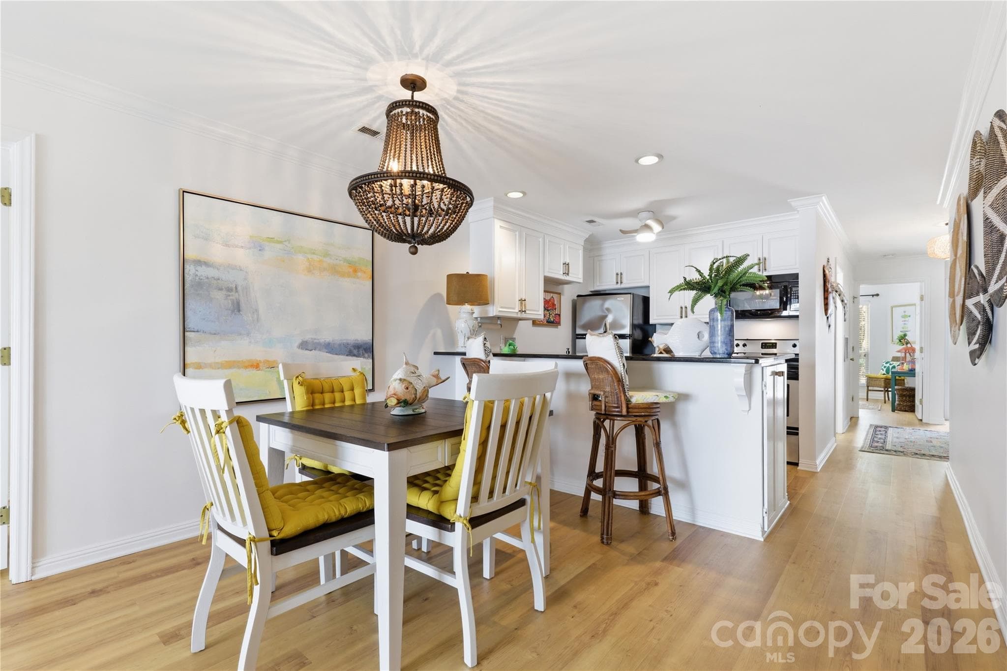 Dining area positioned to enjoy the home’s waterfront setting. - 932 Southwest Drive, Davidson