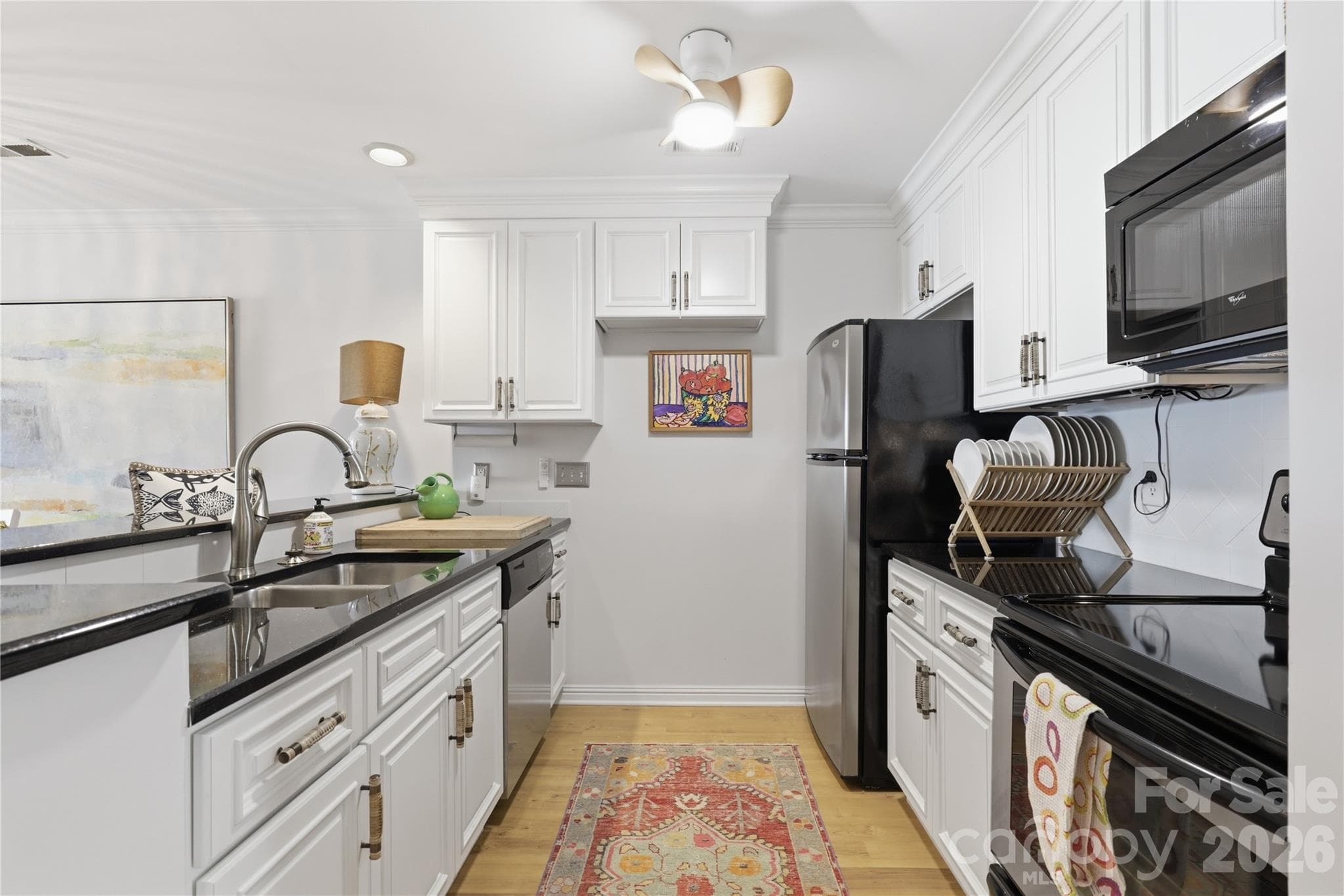 Convenient kitchen workspace with easy access to the dining area. - 932 Southwest Drive, Davidson