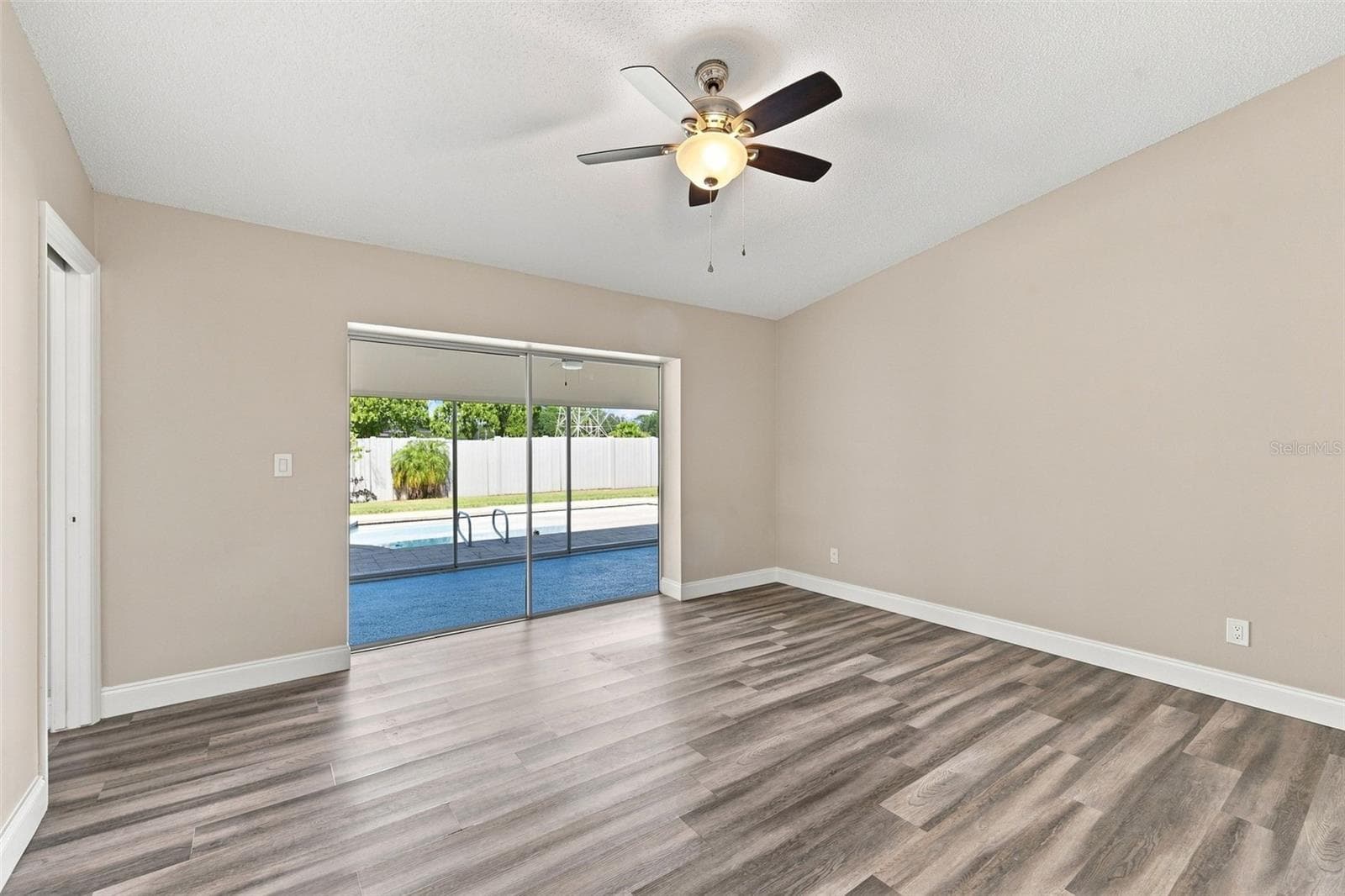 Primary bedroom is a retreat with pool access - 3276 FOX HILL DR, CLEARWATER