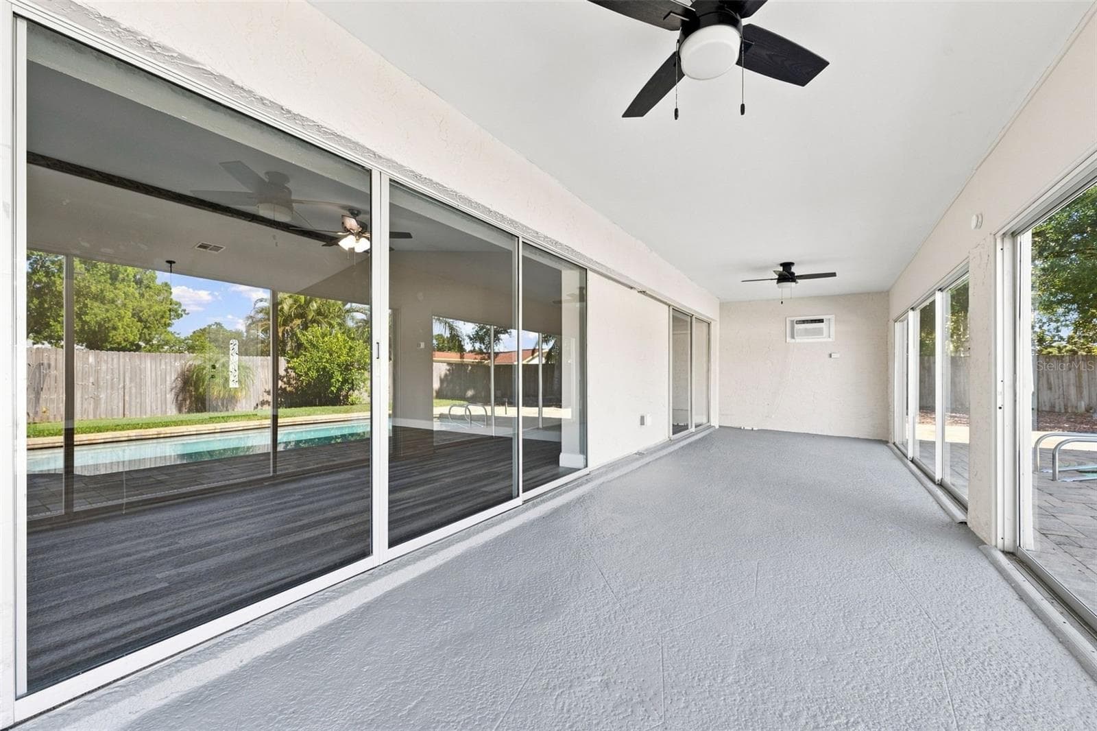 Sliders to Lanai from primary and great room - 3276 FOX HILL DR, CLEARWATER