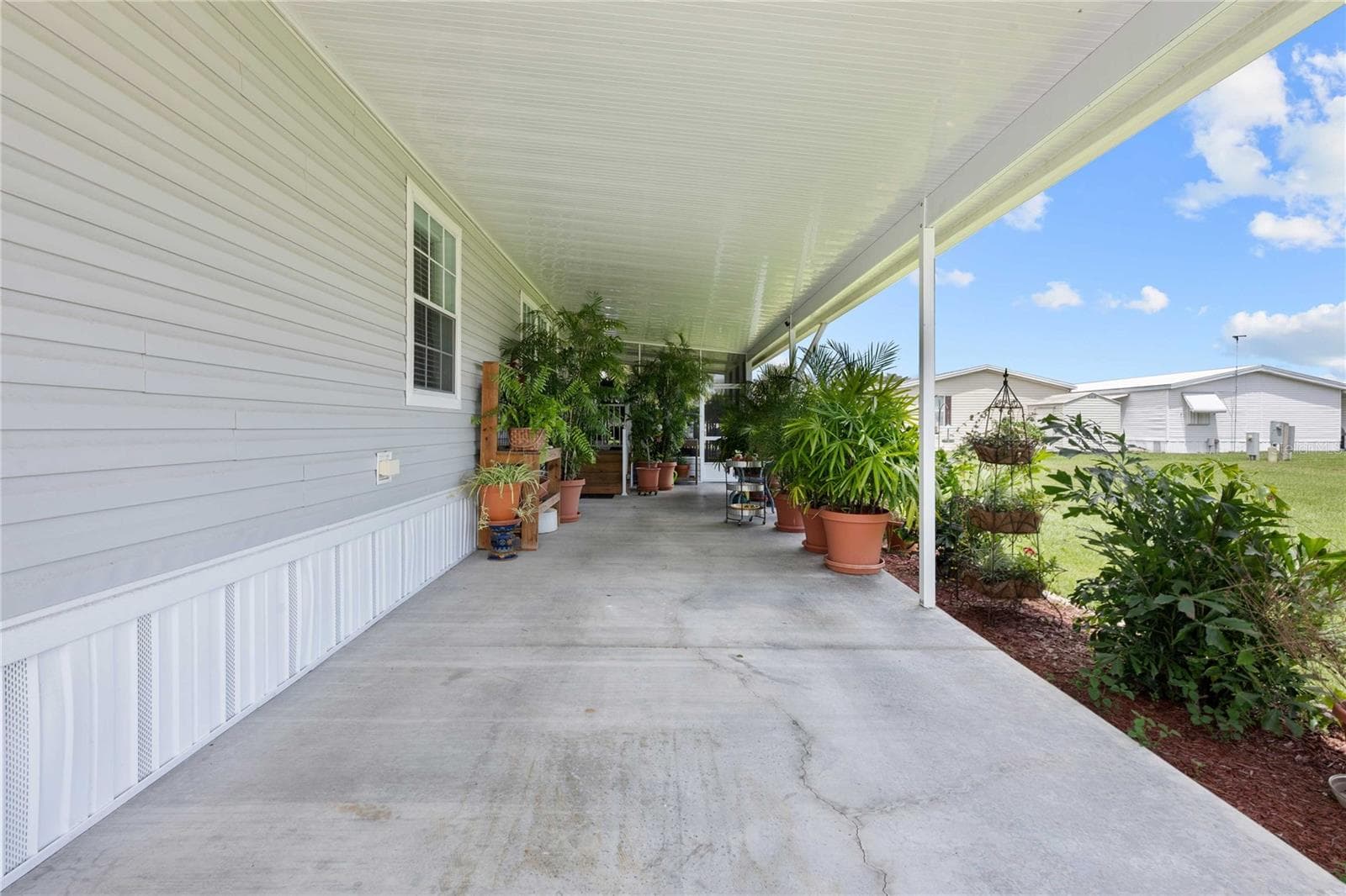 Double carport. - 38417 MONET DR, ZEPHYRHILLS