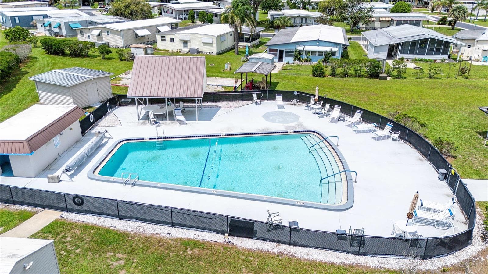 Community heated pool area. - 38417 MONET DR, ZEPHYRHILLS